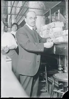 Banking Prints: Bank Cashier with Stacks of Bills