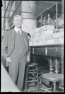 Banking Prints: Bank Cashier with Stacks of Bills