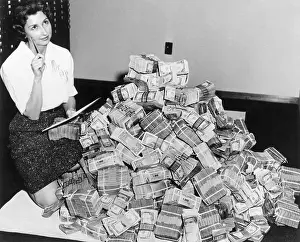Us Dollars Prints: Bank Employee Sitting by a Million Dollars in Cash