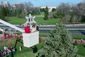 Barbara Bush Riding in Basket Holding Star