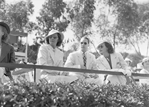 Prints of Barbara Stanwyck, Franchot Tone and Joan Crawford watch a polo match on June 23, 1936. The match was between film stars and the Uplifters Club, to benefit the Children's Convalescent home A Glamorous Life Captured: Barbara Stanwyck, Franchot Tone and Joan Crawford
