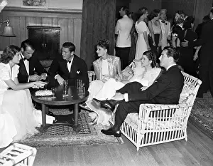Barbara Stanwyck, Gary Cooper, Errol Flynn, Lili Damita, Mrs. Gary Cooper, and Robert Taylor Chatting