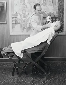 Barber Shaving Customer