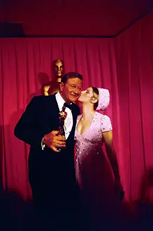 Barbra Streisand Kissing John Wayne at Academy Awards