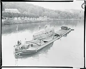 Barge Sailing Down the Seine River