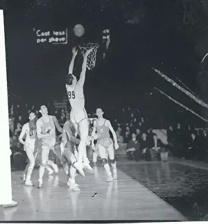 Prints of (Original Caption). Wide Eyed and Open Mouthed. New York: Note the expressions on the faces of the other players as Bill Barringer of Oklahoma A. and M Hoops Through Time: A Visual Journey of Basketball History: Bill Barringer Dunking Basketball
