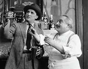 Bartender and Patron Gazing at Drink