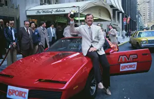 Baseball Favorite Rick Dempsey Posing on Red Sports Car