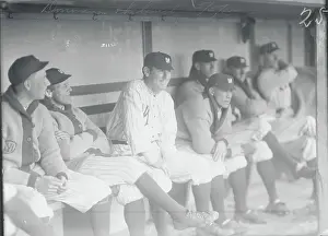 Baseball Manager and Teammates on Bench