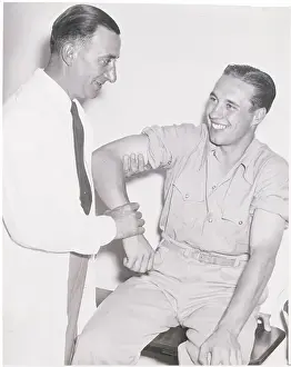 Baseball Player Bob Feller Being Examined by Physician