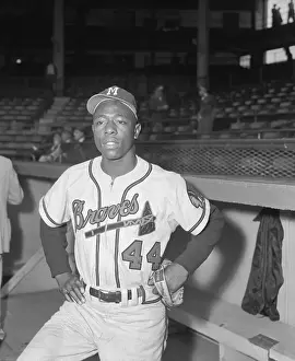 Stan Musial Prints: Baseball Player Hank Aaron Standing in Dugout