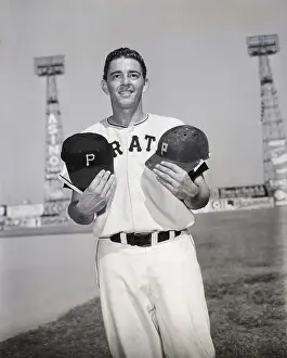 Protective Prints: Baseball Player Holds Cap, Protective Hel