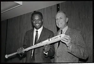 Baseball Player and Manager Holding Bat