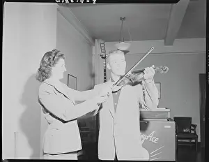 Baseball player Mickey Mantle Learning the Violin