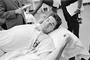 Baseball Player Pete Rose Lying on Cot After Field Injury