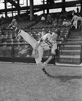 Baseball Player Pitching in Action
