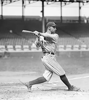 Baseball Player Takes Swing With Bat