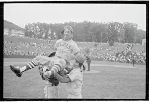Baseball Players Carrying a Teammate on Their Shoulders