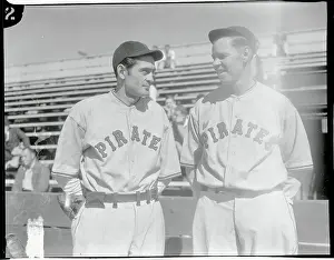 San Bernardino Prints: Baseball Players Guy Bush and Babe Herman Conversing Near Stands