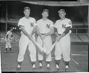 Baseball Players Pointing Their Bats