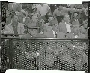 Baseball Representatives Sitting in Front Bleachers Before Game