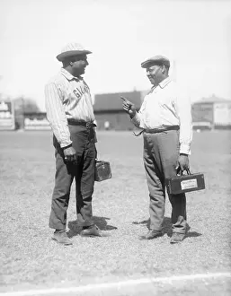 William A Prints: Baseball Trainers Conversing on Field