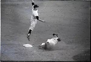 Baseman Making A Catch/Runner Sliding