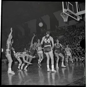 Basket ball player Wesley Bialosuknia Diving to Floor