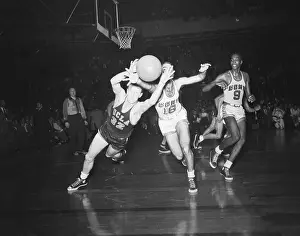 Basket Ball Players Jump For Ball