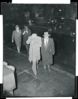 Basketball Gamblers Being Led to Stationhouse