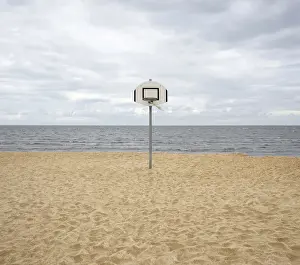 Cloud Blanket Prints: Basketball hoop on a deserted North Sea beach