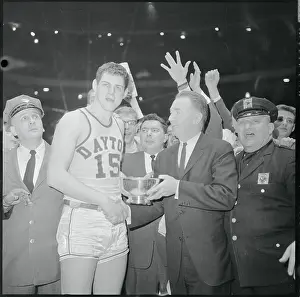 Basketball Player Receiving Trophy