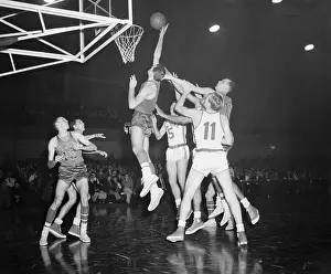 Basketball Players in Action at the Net