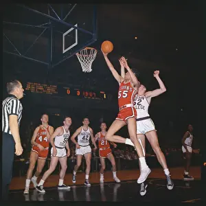 Basketball Players Battling at Net