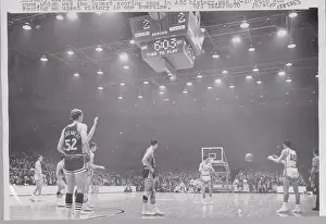 Basketball Players Competing in Game