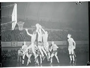 Prints of (Original Caption). Philadelphia, Pennsylvania: Action during the Temple-Minnesota basketball game. Minnesota won 38-35. December 29, 1938 Hoops Through Time: A Visual Journey of Basketball History: Basketball Players on Court