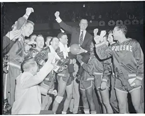 Basketball Teammates Carrying Their Coach