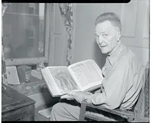 Battling Nelson Looking Through Book