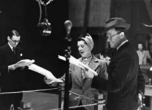 Prints of May 1942: From left to right, Jack Train, Dorothy Summers and English comedian Tommy Handley (1892 - 1949), stars of the radio show ´It´s That Man Again´ or ´ITMA´ Discover the Vision of Haywood Magee – A Master of Mid-Century British Life: BBC At Bangor