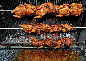 Medium Group Of Objects Gallery: BBQ grilled chicken, chicken on rotating skewers