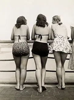 Beach Beauties Leaning on Railing