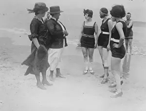 Beach Goers Conversing with Policewoman