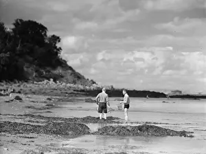 Prints of circa 1930: Two men paddling amongst the rock pools on a beach. (Photo by Chaloner Woods/Getty Images) Chaloner Woods Photography Prints: Beach Pals