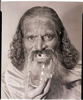 Bearded Man Eating Glass