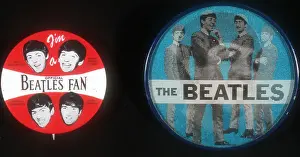 Prints of CIRCA 1965: Two buttons which are memoribilia of rock and roll band The Beatles featuring pictures of the band. (Photo by Michael Ochs Archives/Getty Images) The Beatles Through the Lens: Beatles Buttons