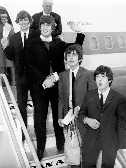 Beatles Disembarking From A Plane