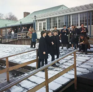 The Beatles Standing on a Bridge