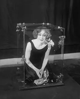 Escaping Prints: Beatrice Houdini Demonstrating an Illusion