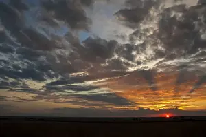 A Beautiful African sunset with sun rays over the agricultural farm lands of the North West Province in South Africa