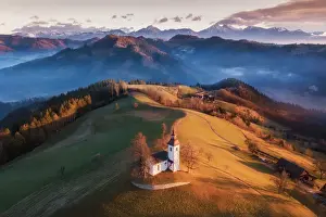 Beautiful Sunrise Landscape Of Saint Thomas Church and Julian Alps In Slovenia